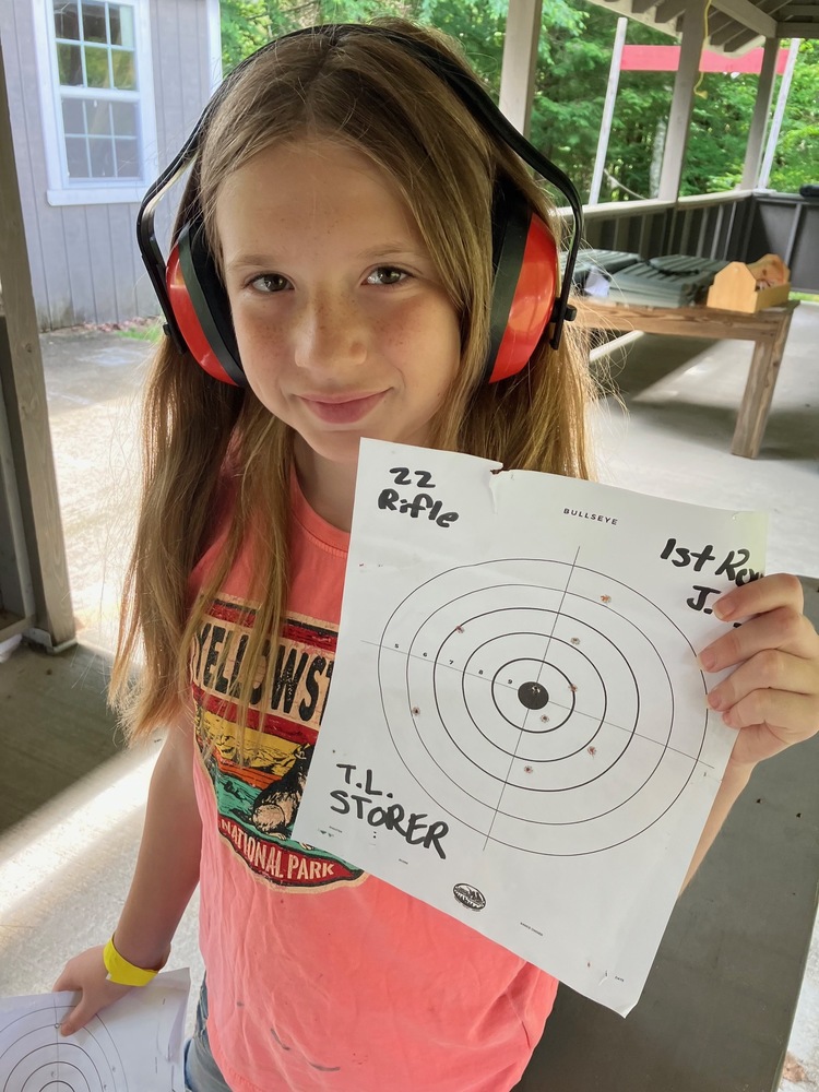 Student showing a target at the rifle range