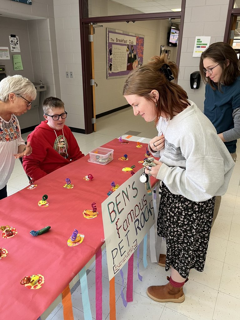 Student picking out Ben's Famous Pet Rocks