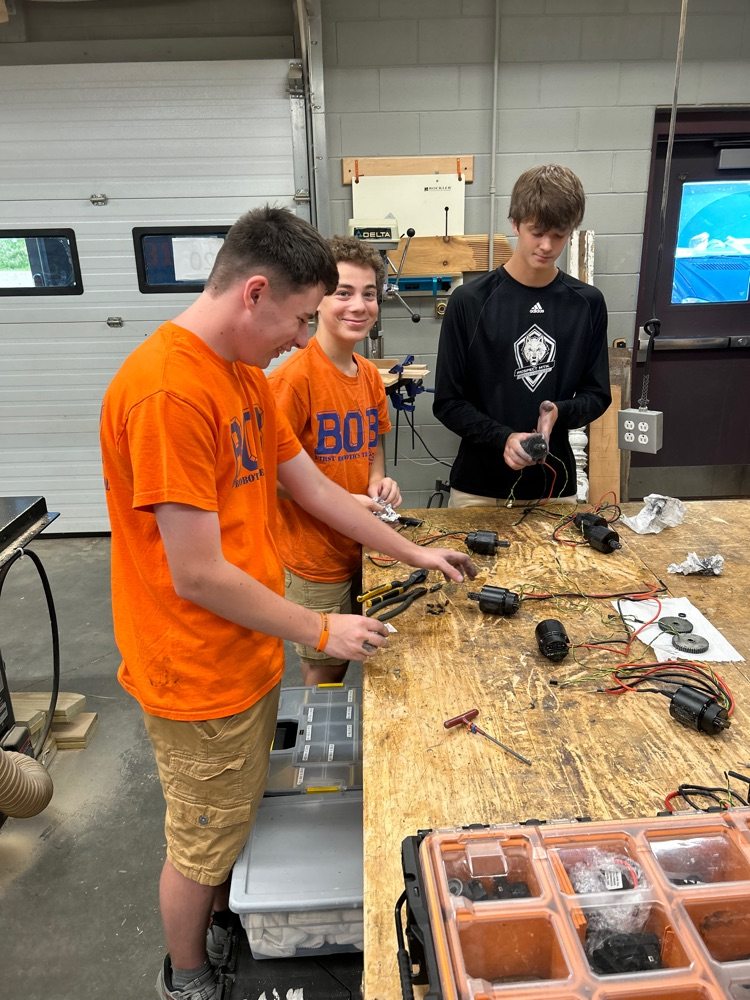 Team 319 members in robotics lab